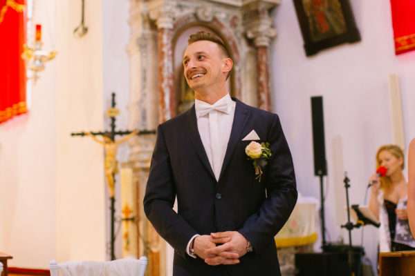 The groom at the altar